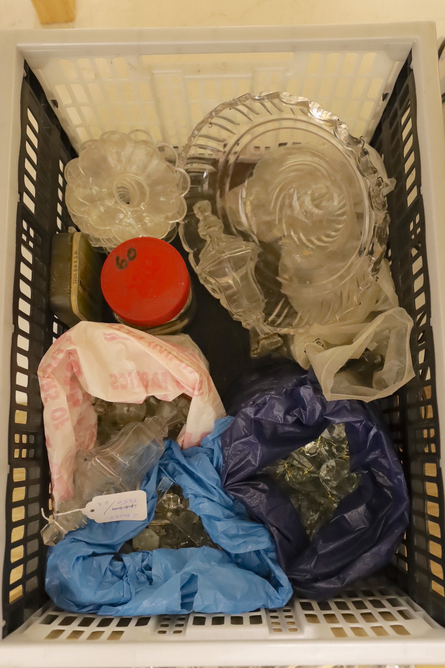 A large group of cut glass chandelier parts and prismatic cut drops